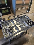 Wolf 36 Inch Gas Cooktop 5 Burner Stainless Ct36g/s And Pop Up Vent Dd361. Fixed Price $2500.00.